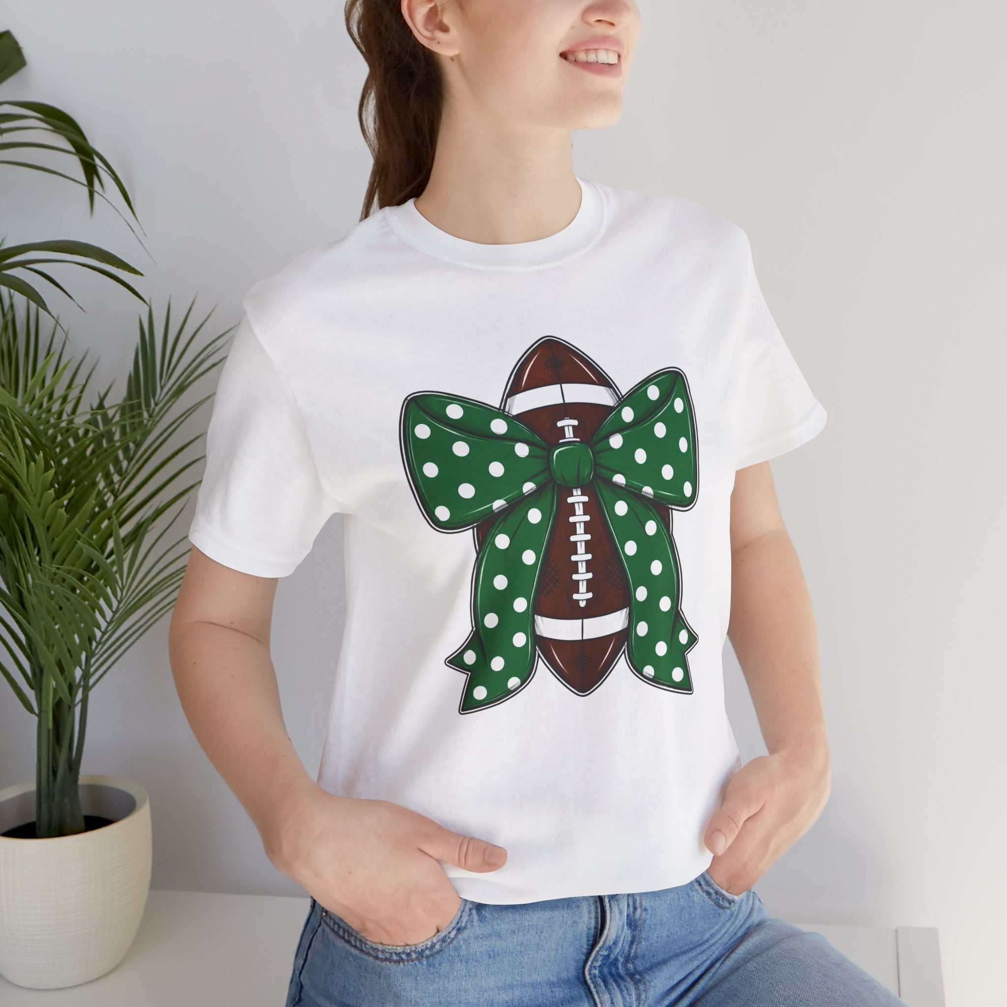 Football Bow T-Shirt — Green Polka Dot Bow Over Football Graphic