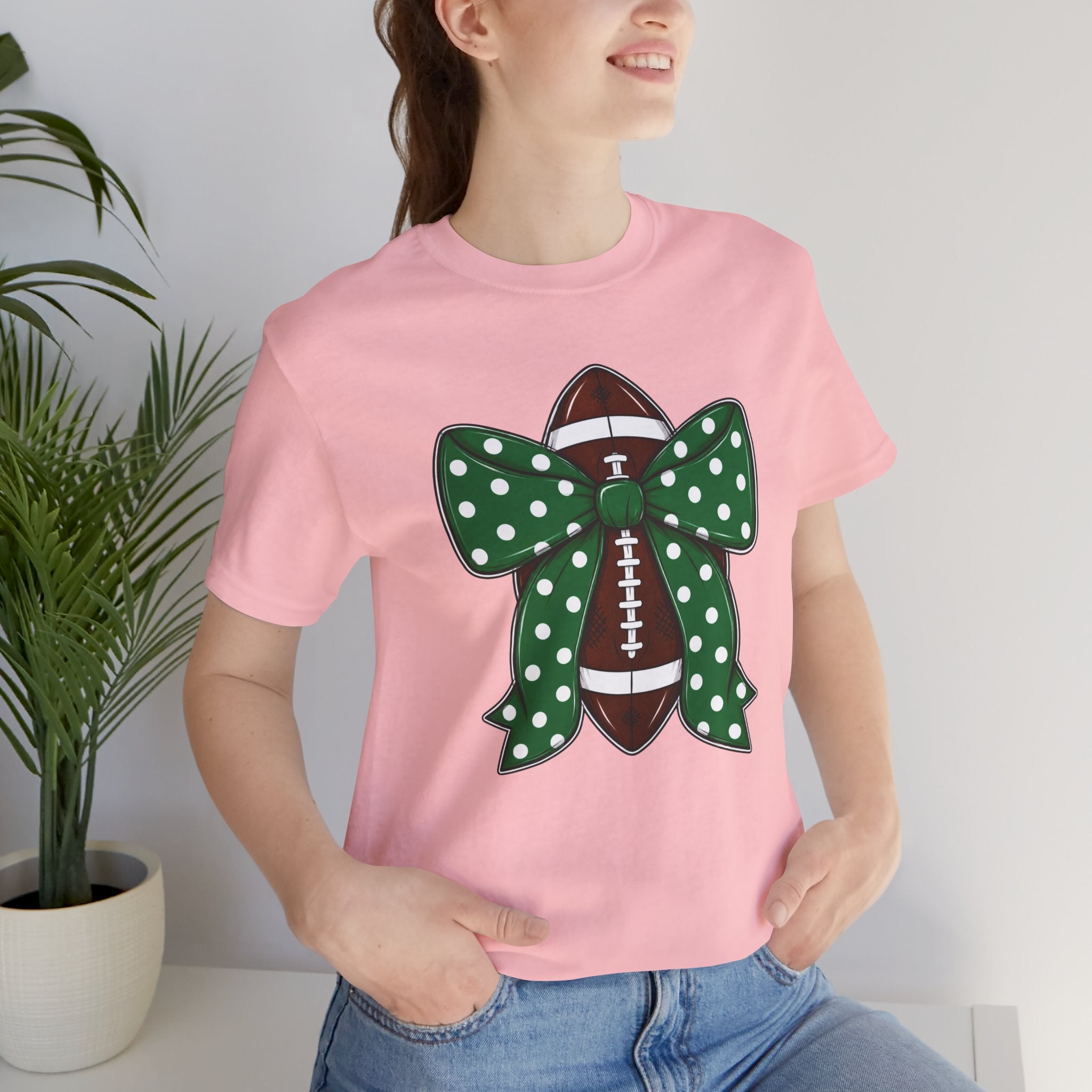 Football Bow T-Shirt — Green Polka Dot Bow Over Football Graphic