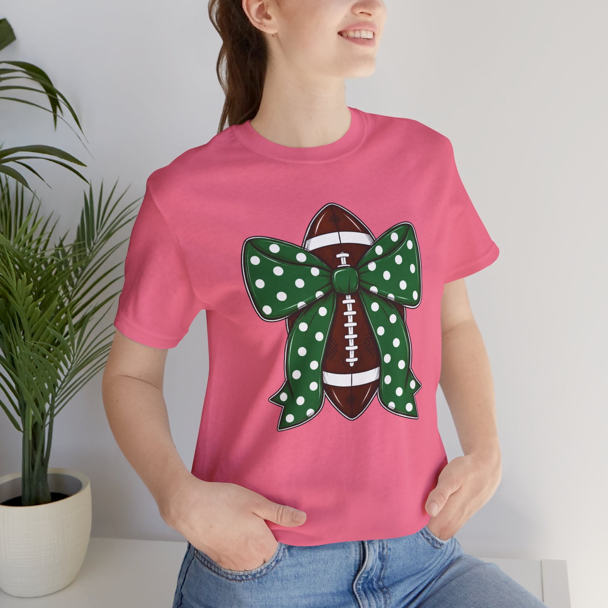 Football Bow T-Shirt — Green Polka Dot Bow Over Football Graphic